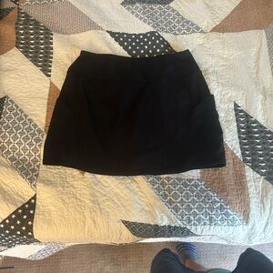 Classic Black Women's Tennis Skirt with pockets and shorts